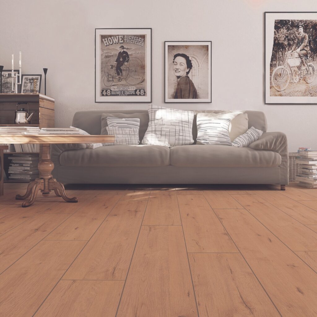 Photo shows a lounge with wood style laminate flooring. Laminate flooring is available from Wall Bros in Worthing and Storrington