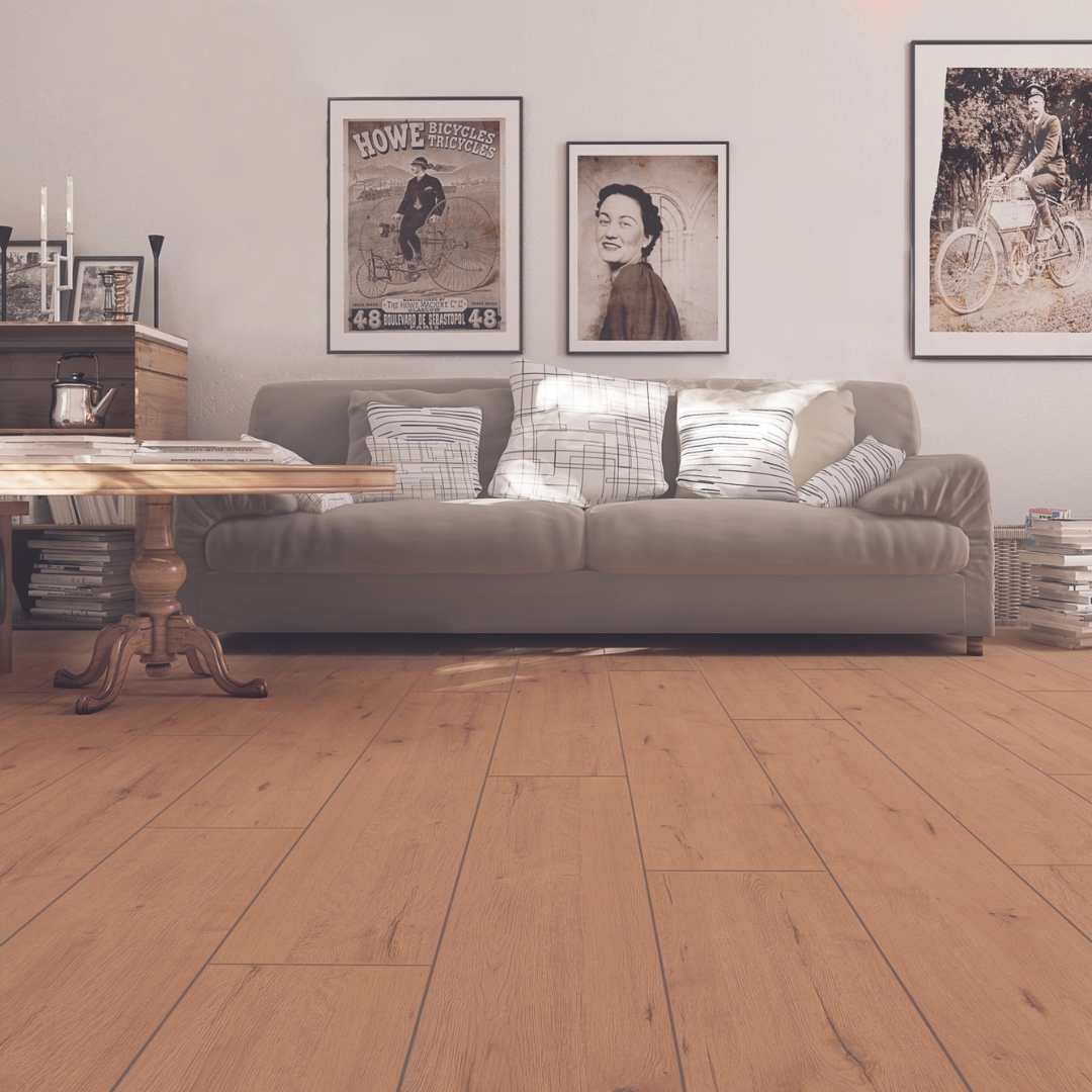 Photo shows a lounge with wood style laminate flooring. Laminate flooring is available from Wall Bros in Worthing and Storrington